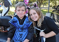 Chase Polivchak, 6, passed out candy with his sister, Zoe, 9.