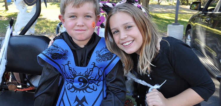 Chase Polivchak, 6, passed out candy with his sister, Zoe, 9.