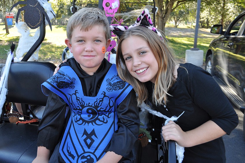 Chase Polivchak, 6, passed out candy with his sister, Zoe, 9.