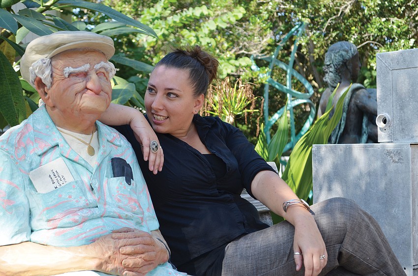 Emma Thurgood checks in on her favorite permanent piece at Art Center Sarasota, 