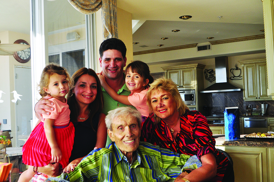 Clockwise from bottom: Marty Samowitz celebrates with granddaughter Gia Haynes, daughter and son-in-law Lani and Chad Haynes, granddaughter Kayla Haynes and his wife, Paulette.
