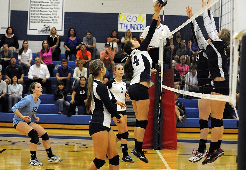 ODAâ€™s Taylor Albano tips the ball back over the net for a point late in the fourth set.