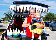 Dan Stephens, pictured with his daughter, Summer, decorated his tailgate with an ocean theme.