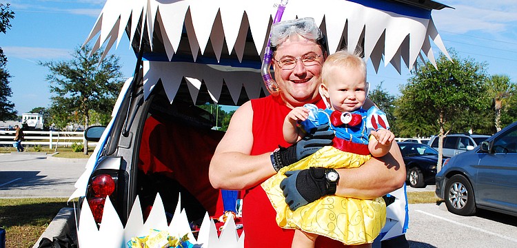 Dan Stephens, pictured with his daughter, Summer, decorated his tailgate with an ocean theme.