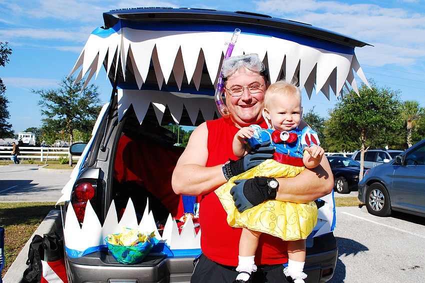 Dan Stephens, pictured with his daughter, Summer, decorated his tailgate with an ocean theme.