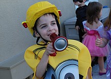 Beckett Smith, 4, "honked" at the crowd, during a Halloween-themed parade at The Goddard School.
