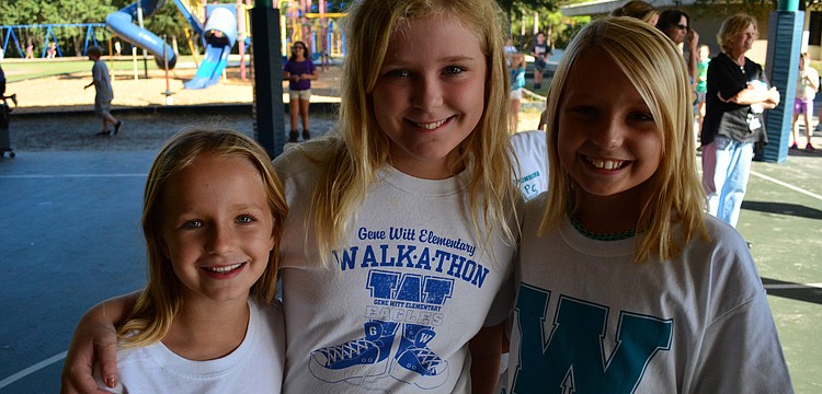 Marissa Veith, Ilona Van Sprundel and Lexi Bruneman were eager to see their teacher get wet in the dunk tank.