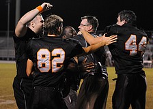 The Sarasota High football team celebrates following its 41-14 victory over Lakewood Ranch Nov. 1.