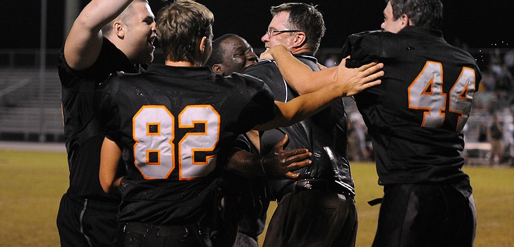 The Sarasota High football team celebrates following its 41-14 victory over Lakewood Ranch Nov. 1.