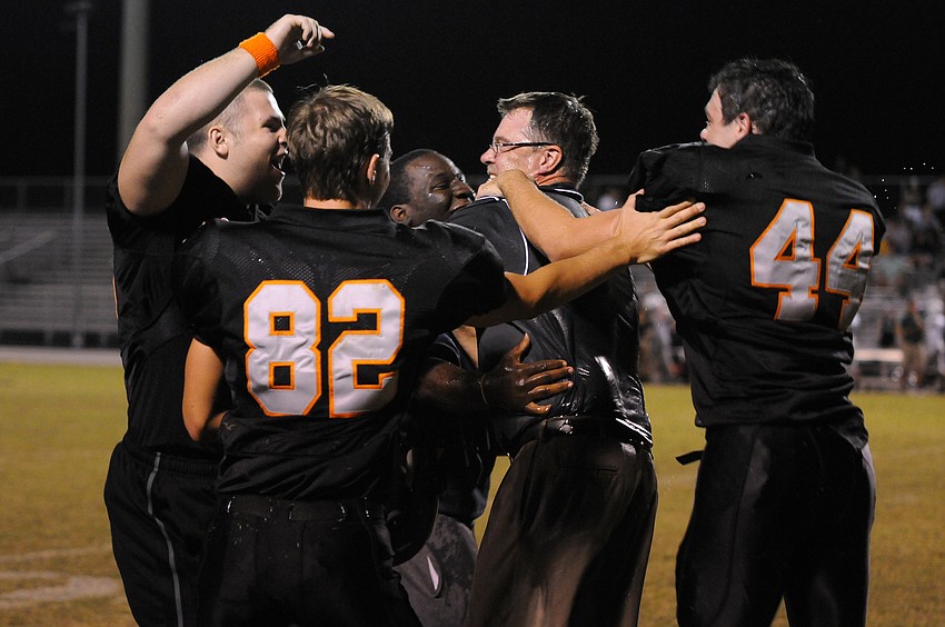 The Sarasota High football team celebrates following its 41-14 victory over Lakewood Ranch Nov. 1.
