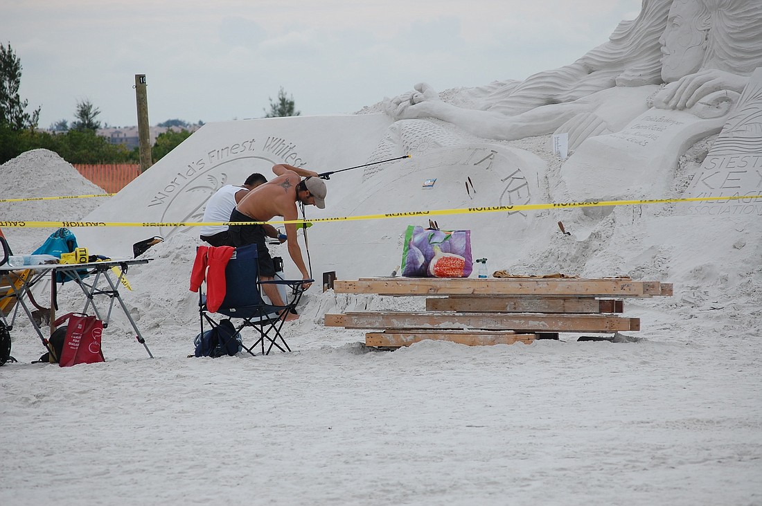 Master sand sculptors arrived early to help create the sponsor sculpture for the 2012 Siesta Key Crystal Classic.