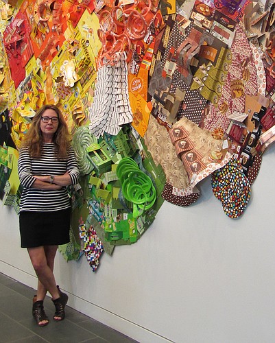 Lisa Hoke poses with one of her works (courtesy photo)