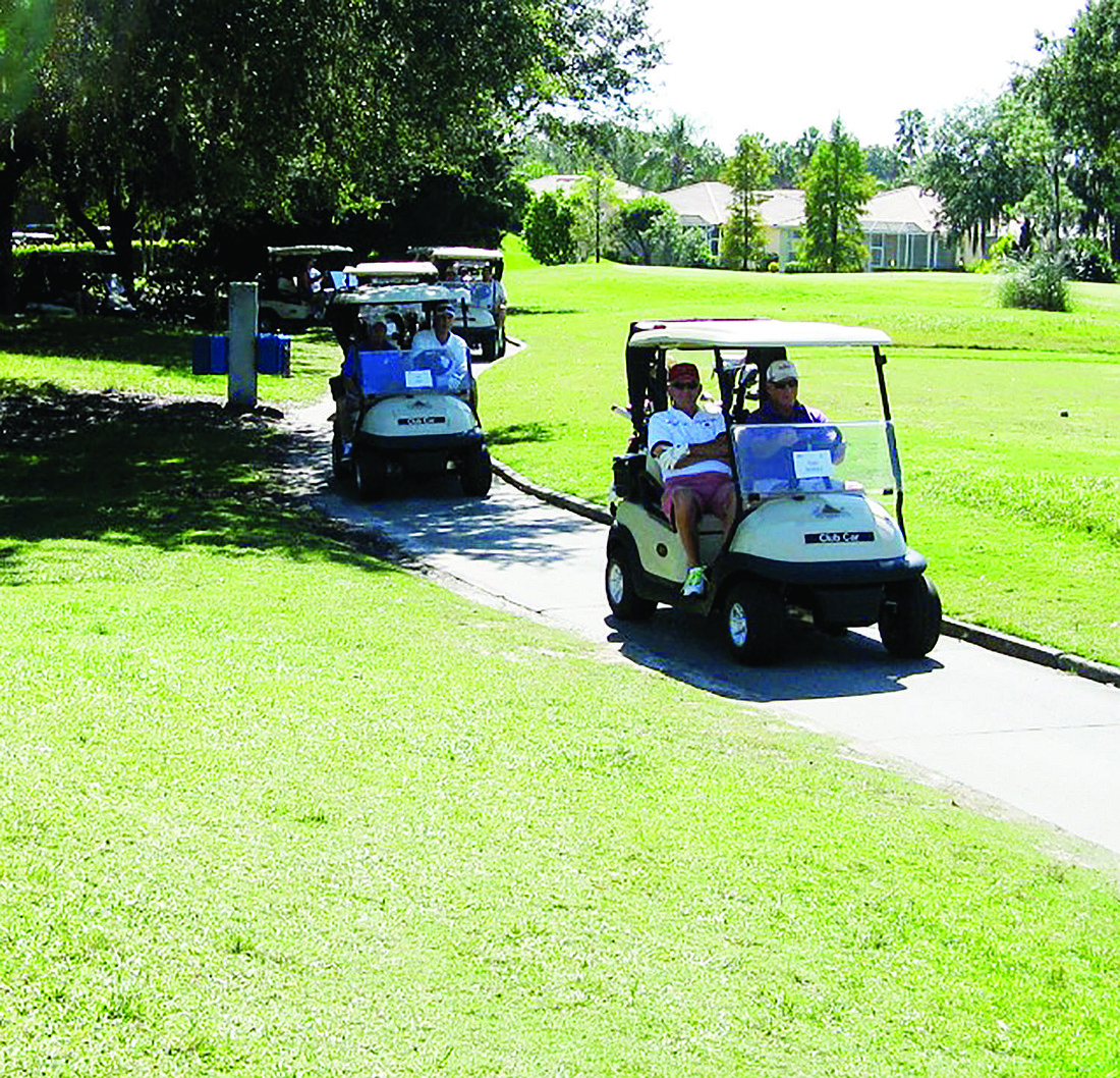 More than 100 golfers turned out for the event, which raised more than $5,000 for local charities.