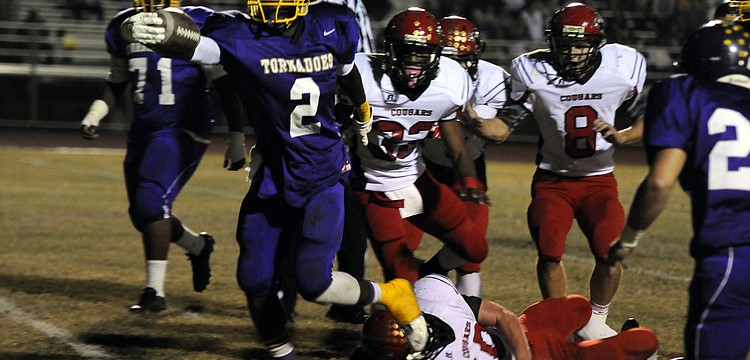 Booker running back Marlon Mack scored on runs of 6, 82, 24 and 85 yards to lead the Tornadoes to a 26-14 victory over Cardinal Mooney Nov. 8.