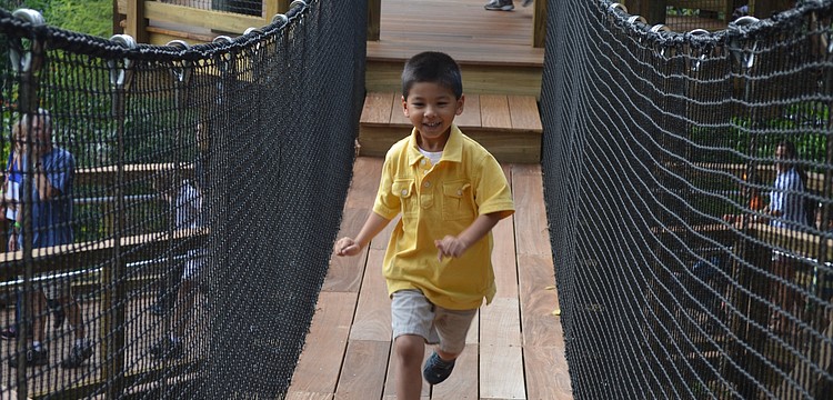 Anderson Chau runs down the bridge