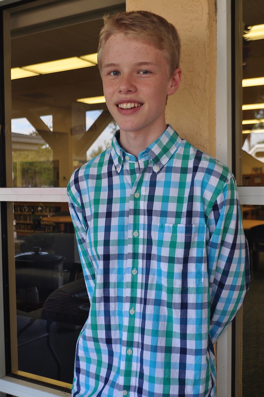 Jacob Lothman served chili for the chili cook-off.