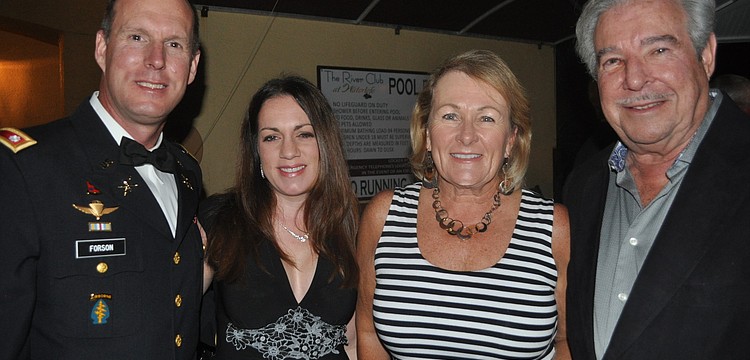 Mike Forson, who currently serves in the Army National Guard, with his wife, Angela, and Robyn and Howie Drourr of Michael Saunders & Company, an event sponsor