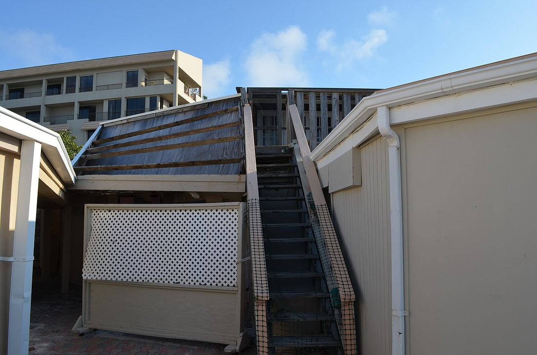 Three unit owners are threatening legal action if the current Colony Beach & Tennis resort buildings arenÃ¢â‚¬â„¢t upgraded.