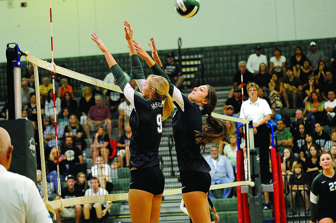 Lakewood RanchÃ¢â‚¬â„¢s Coleen Campbell and Nicole Grant go up for a block against Naples Gulf Coast.