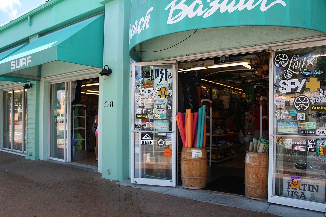 Souvernir displays are kept within the doorway at the Beach Bazar in the Siesta Key Village, abiding by a county ordinance that bans Siesta merchants from outdoors displays of merchandise.