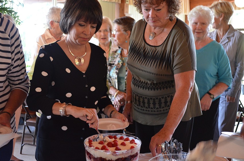 Debbie Shapiro serves herself some trifle
