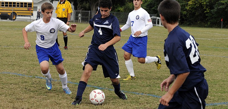 ODAâ€™s Jose Juncosa attempts to maneuver the ball past SMAâ€™s Connor Moriarty.