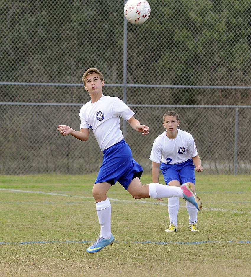 SMAâ€™s Connor Moriarty heads the ball.
