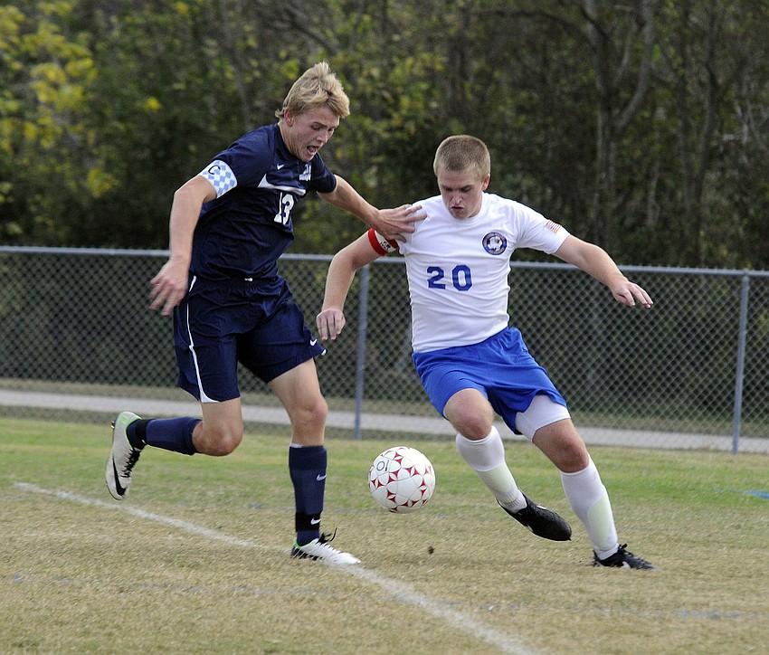 ODAâ€™s Tait Lystad and SMAâ€™s Mitchell Burchett fight for possession during their non-district game Nov. 14.