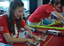 Ashley Light from YPG wraps a gift