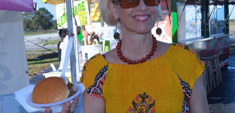 Cynthia Simpson starts her morning with a barbecue sandwich.