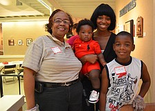 Charlesette Hudson, Saquess Mapps with her son Tyree Kelly and Dâ€™Kai Shaw