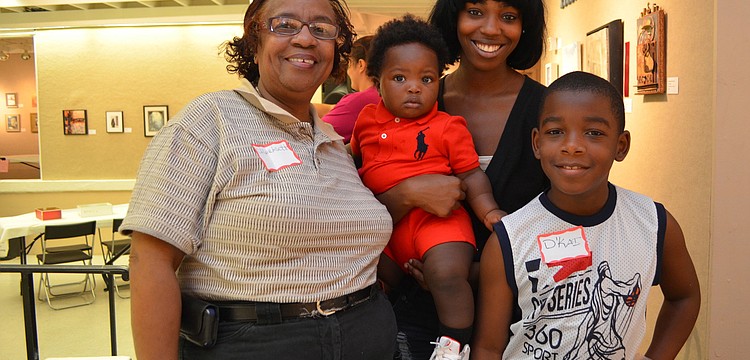 Charlesette Hudson, Saquess Mapps with her son Tyree Kelly and Dâ€™Kai Shaw