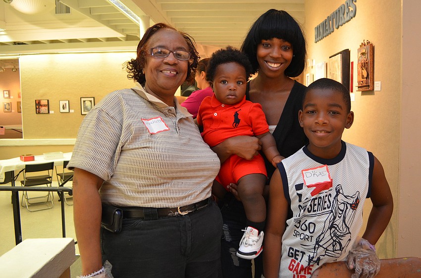 Charlesette Hudson, Saquess Mapps with her son Tyree Kelly and Dâ€™Kai Shaw
