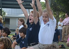 Tyler G. and James G. celebrate their teamâ€™s touchdown