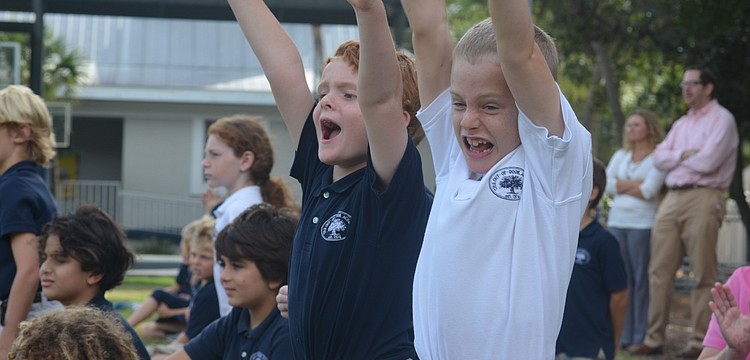 Tyler G. and James G. celebrate their teamâ€™s touchdown