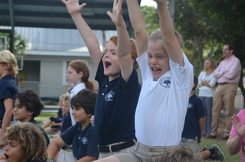 Tyler G. and James G. celebrate their teamâ€™s touchdown