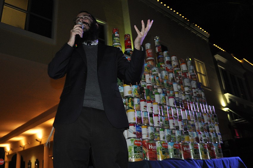 Rabbi Mendy Bukiet explains the menorah is made of cans, because it was the first time Hannukah overlapped with Thanksgiving.