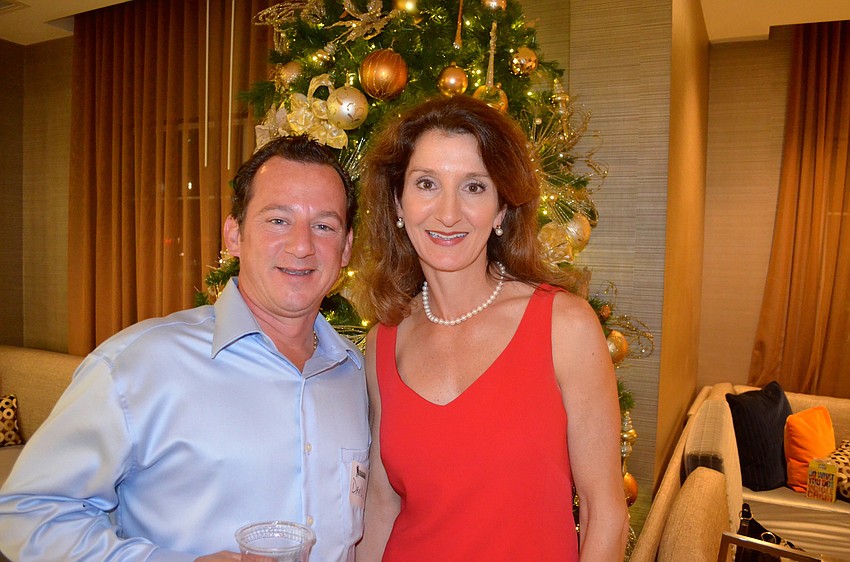 David Neff and Anne Weichel find a spot near the glitz of the Christmas tree.