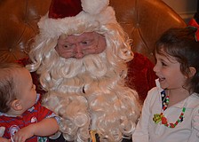 Finley and Madison Anderson tell Santa what they want for Christmas