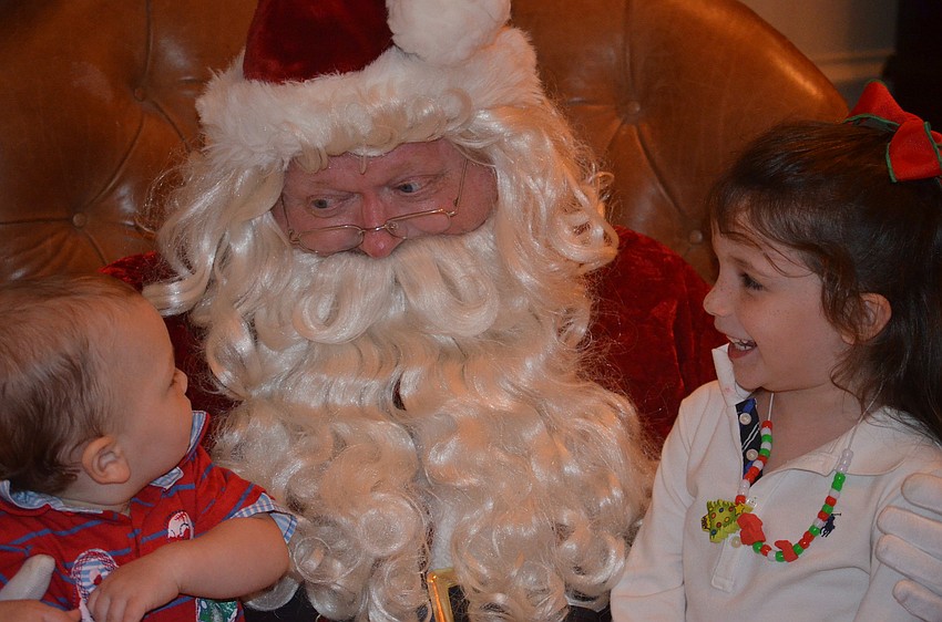 Finley and Madison Anderson tell Santa what they want for Christmas