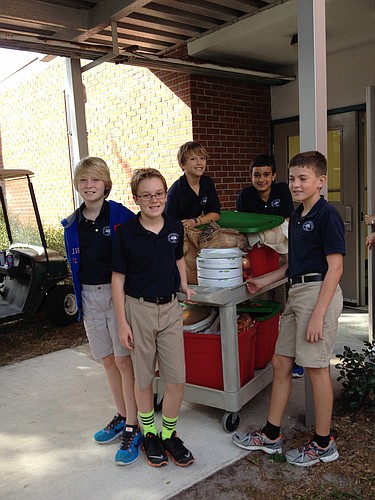 Courtesy photo. William, Evan, Phineas, Grant and Leonard helping with Thanksgiving baskets for Gocio