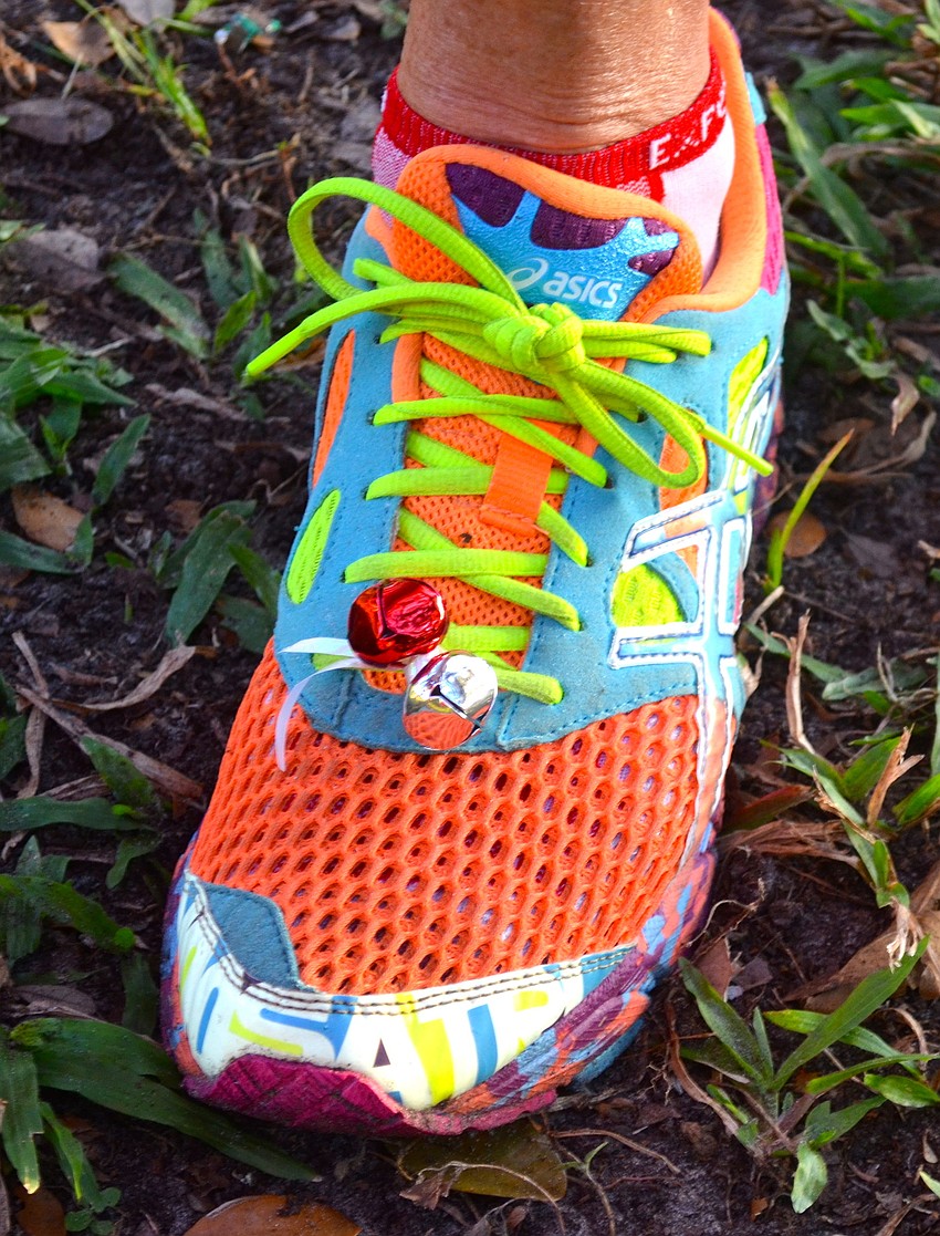 Runners tie Christmas-colored bells to their laces in honor of the eventâ€™s name.