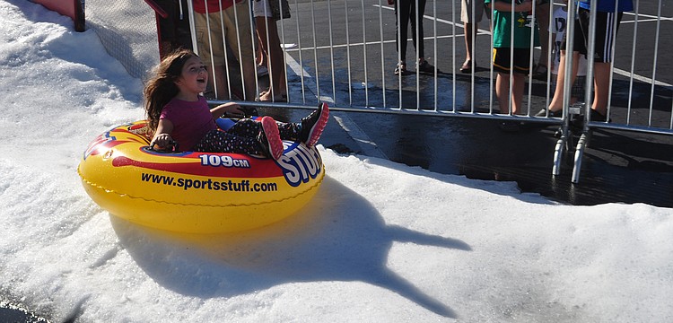 lexandra Keusch, 5, has fun sledding.