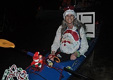Judy Zolna participates in the parade in her kayak.