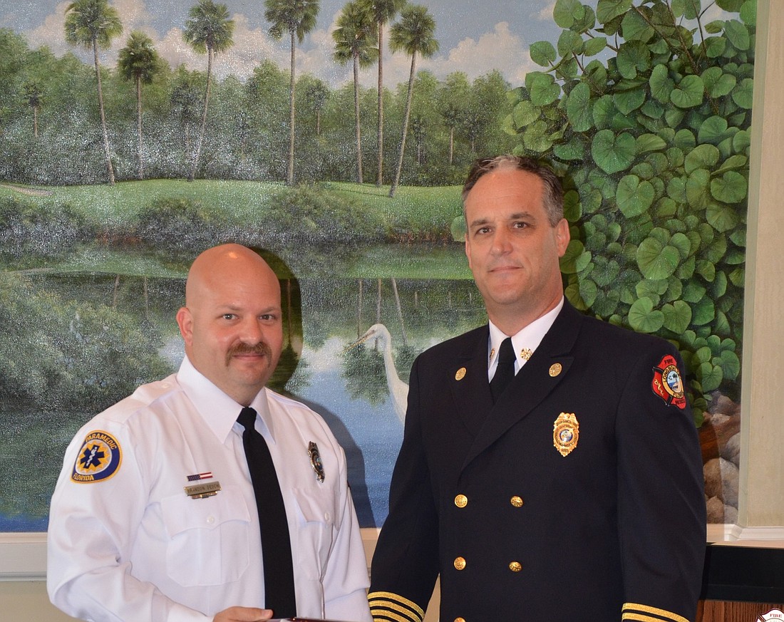 Firefighter/paramedic Brandon Desch, with Fire Chief Paul Dezzi, received the Chief's Award.
