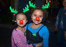 Six-year-olds Grace Grogan and Stephanie Green play Rudolph.