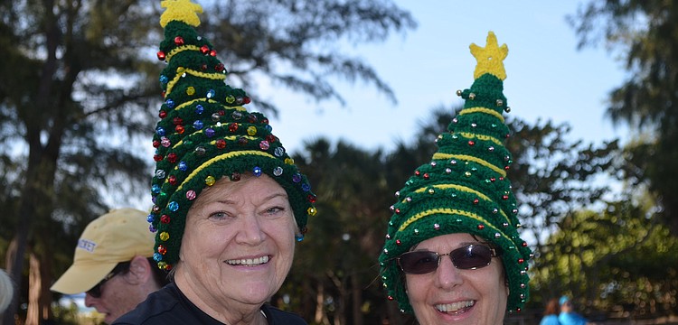 Shirley Matchett and Debby Frederick wear homemade Christmas hats.