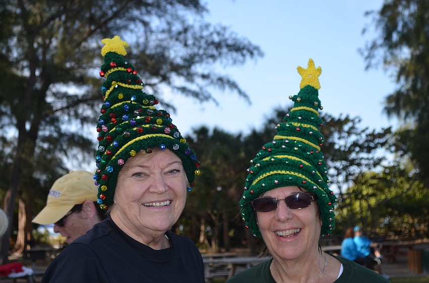 Shirley Matchett and Debby Frederick wear homemade Christmas hats.