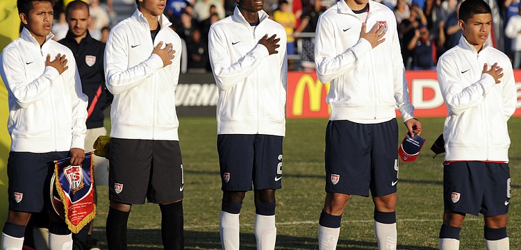Members of the U.S. Under-17 Menâ€™s National Team sing the Star Spangled Banner before the start of their match against Brazil Dec. 13.