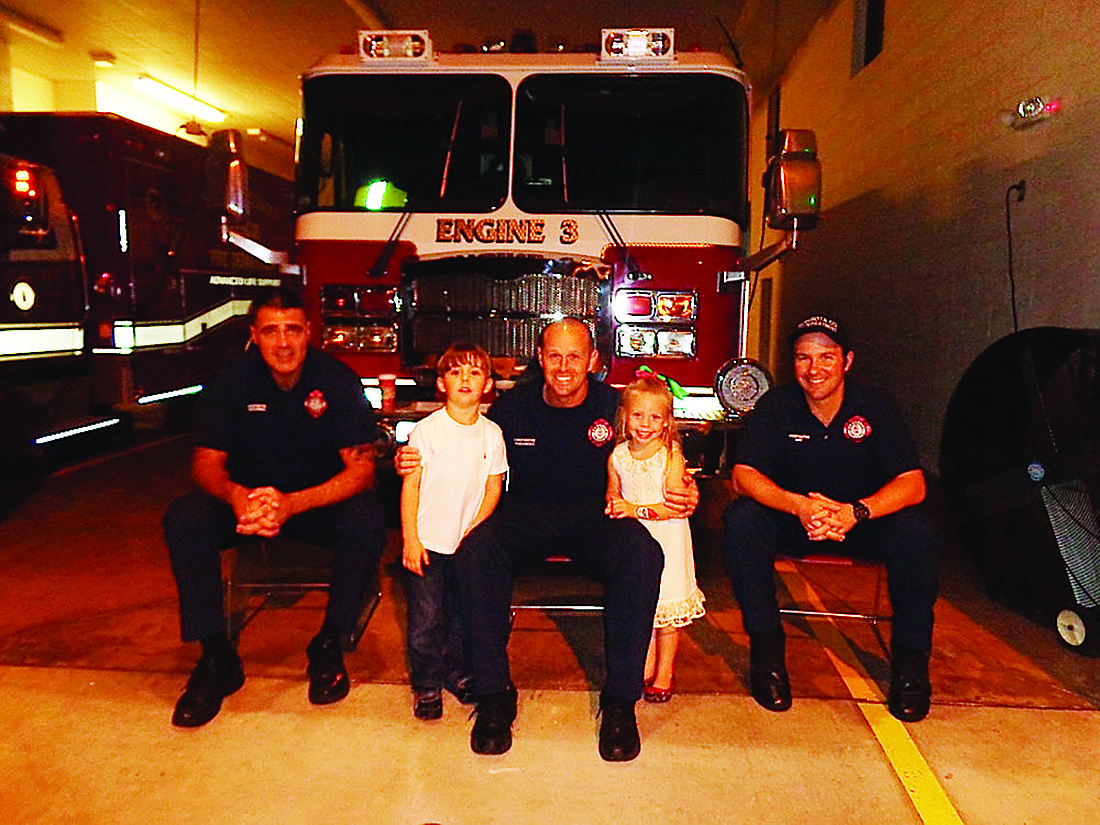 Courtesy photo. Garrett and Lauren-Taylor Nock thank Sarasota firefighters.